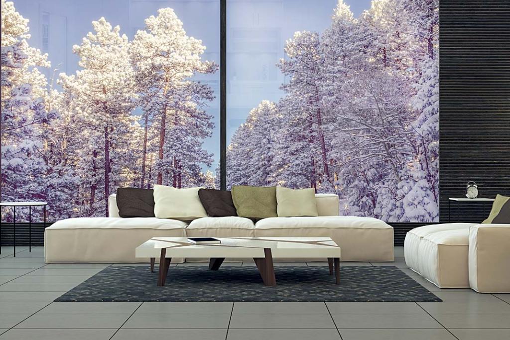 Panoramiczne okna w rozmiarze XXL firmy Awilux zapewniają ciepło wewnątrz i widok na zimowy ogród