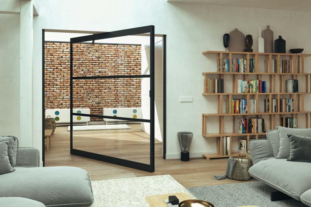 Aliplast_LOFT_Przeszklone drzwi ułatwiają wydzielenie funkcjonalnych stref bez zaciemniania i pomniejszania wnętrz. W szerokim przejściu efektownie zaprezentują się drzwi obrotowe